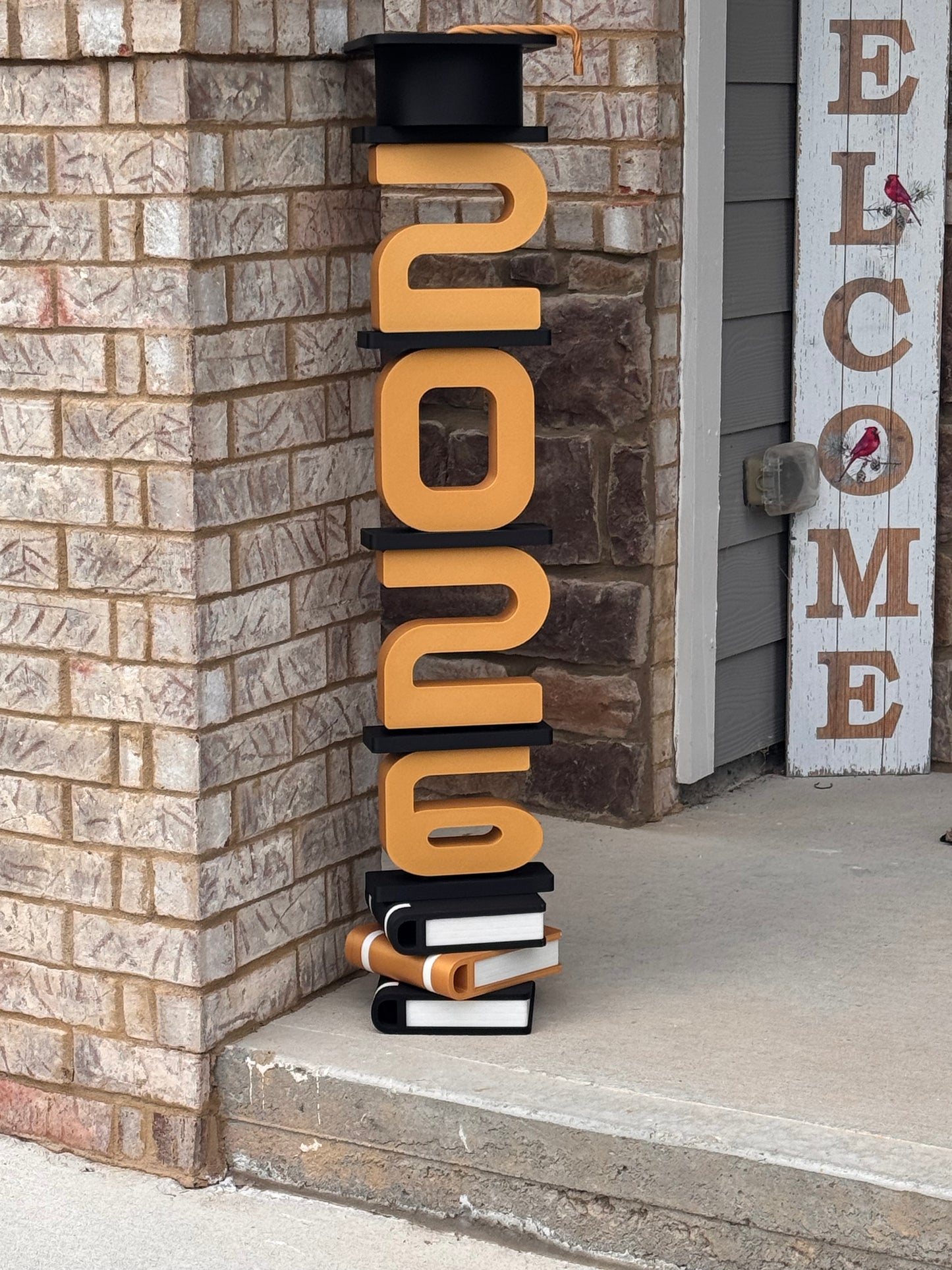 Stacked Graduation Sign with Cap & Books Base